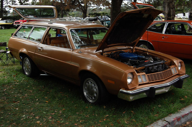 Brown Pinto wagon with the hood up at a car show